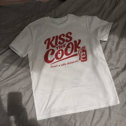 Kiss The Cook T-Shirt — Retro Red Graphic Tee ("Kiss The Cook from a safe distance")