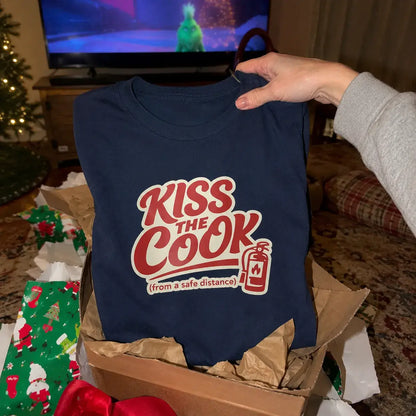 Kiss The Cook T-Shirt — Retro Red Graphic Tee ("Kiss The Cook from a safe distance")